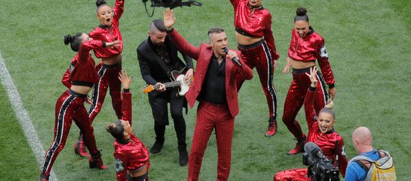 Soccer Football - World Cup - Opening Ceremony - Luzhniki Stadium, Moscow, Russia - June 14, 2018 Robbie Williams performs during the opening ceremony Soccer Football - World Cup - Opening Ceremony - Luzhniki Stadium, Moscow, Russia - June 14, 2018 Robbie Williams performs during the opening ceremony - Sputnik International