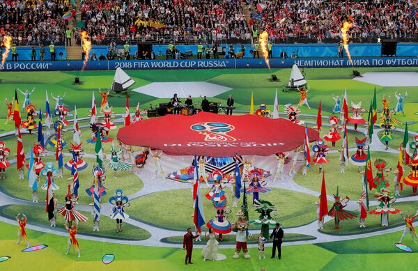 Soccer Football - World Cup - Opening Ceremony - Luzhniki Stadium, Moscow, Russia - June 14, 2018 Robbie Williams, Aida Garifullina, former player Ronaldo and World Cup mascot Zabivaka during the opening ceremony Soccer Football - World Cup - Opening Ceremony - Luzhniki Stadium, Moscow, Russia - June 14, 2018 Robbie Williams, Aida Garifullina, former player Ronaldo and World Cup mascot Zabivaka during the opening ceremony - Sputnik International