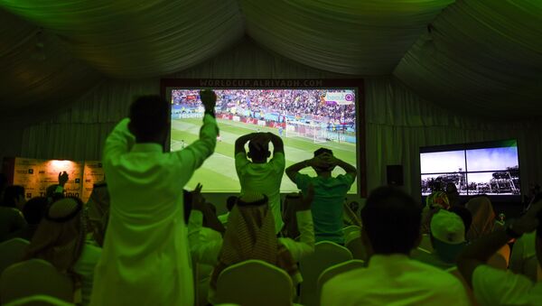 Saudi football fans cheer for their national team during their Russia 2018 World Cup Group A football match against Russia at a fan tent in the capital Riyadh on June 14, 2018 - Sputnik International