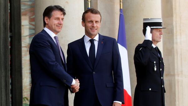 French President Emmanuel Macron welcomes Italian Prime Minister Giuseppe Conte as he arrives for a meeting at the Elysee Palace in Paris, France, June 15, 2018 - Sputnik International