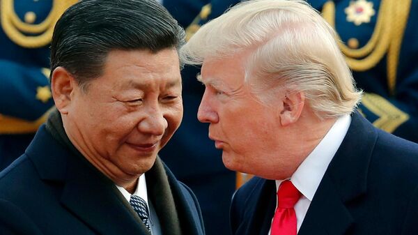 In this Nov. 9, 2017, file photo, U.S. President Donald Trump, right, chats with Chinese President Xi Jinping during a welcome ceremony at the Great Hall of the People in Beijing - Sputnik International
