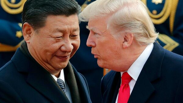 In this Nov. 9, 2017, file photo, U.S. President Donald Trump, right, chats with Chinese President Xi Jinping during a welcome ceremony at the Great Hall of the People in Beijing - Sputnik International