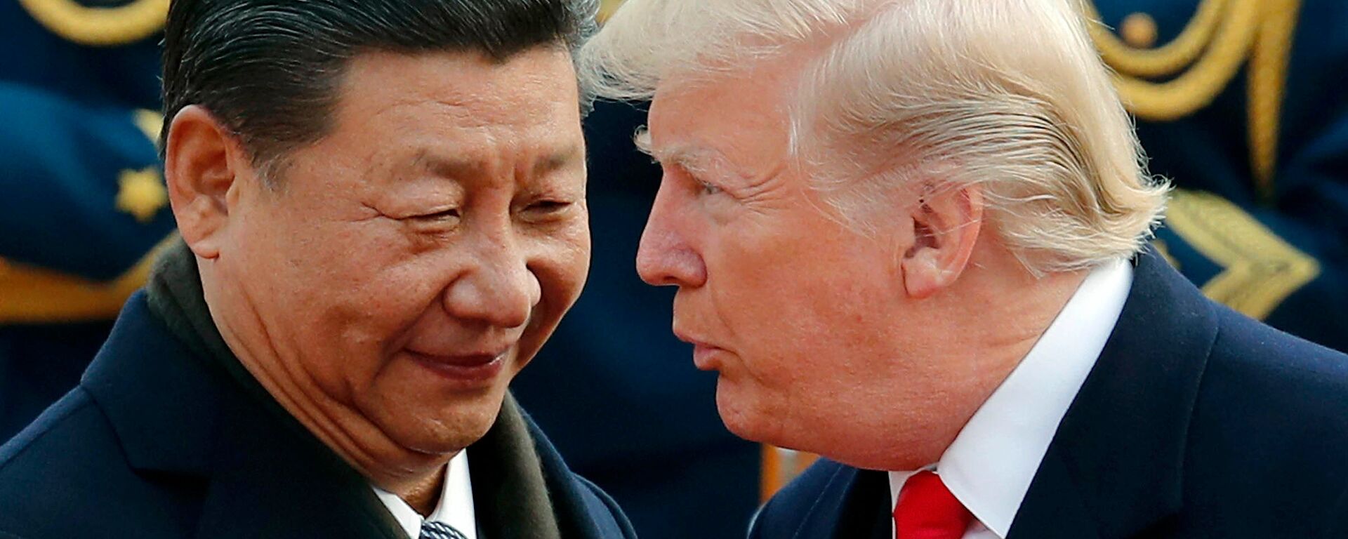 In this Nov. 9, 2017, file photo, U.S. President Donald Trump, right, chats with Chinese President Xi Jinping during a welcome ceremony at the Great Hall of the People in Beijing - Sputnik International, 1920, 08.11.2025