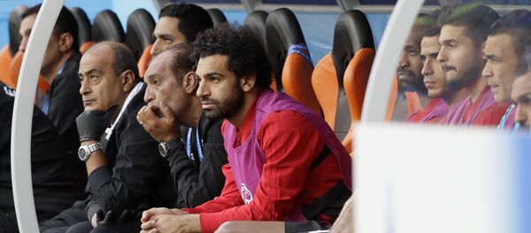 Egypt's Mohamed Salah, center, watches his team during the group A match between Egypt and Uruguay at the 2018 soccer World Cup in the Yekaterinburg Arena in Yekaterinburg, Russia, Friday, June 15, 2018 Egypt's Mohamed Salah, center, watches his team during the group A match between Egypt and Uruguay at the 2018 soccer World Cup in the Yekaterinburg Arena in Yekaterinburg, Russia, Friday, June 15, 2018 - Sputnik International