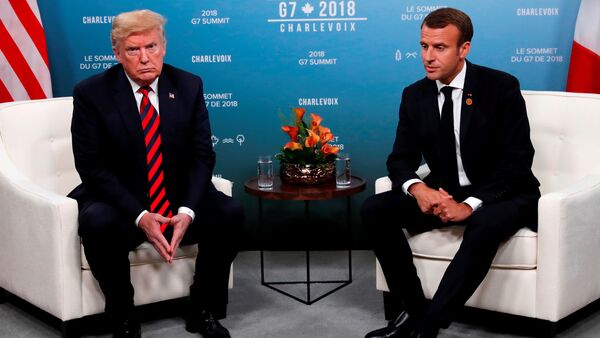 U.S. President Donald Trump and France's President Emmanuel Macron sit side by side during a bilateral meeting at the G7 Summit in in Charlevoix, Quebec, Canada, June 8, 2018. - Sputnik International