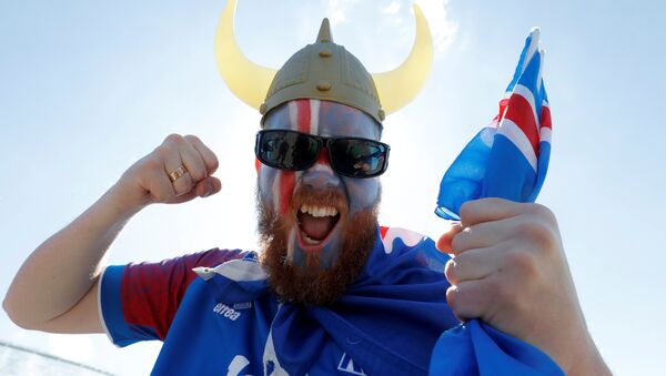 Soccer Football - FIFA World Cup - Group D - Argentina v Iceland - Moscow, Russia - June 16, 2018. A supporter of Iceland cheers in Zaryadye Park - Sputnik International