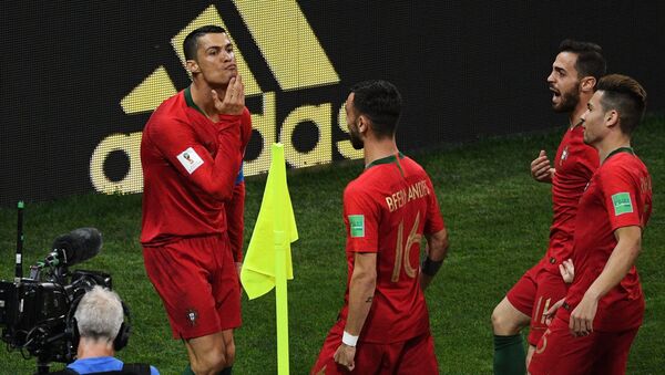 Soccer Football - World Cup - Group B - Portugal vs Spain - Fisht Stadium, Sochi, Russia - June 15, 2018 Portugal's Cristiano Ronaldo celebrates scoring their first goal - Sputnik International