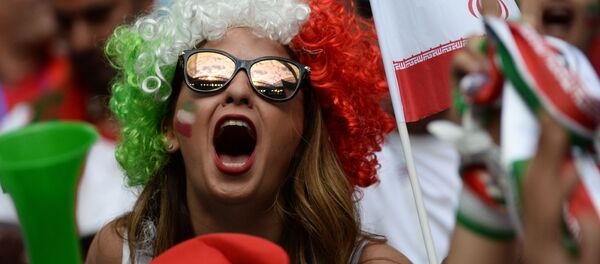An Iranian national football team's fan ahead of a stage World Cup match between Morocco and Iran at St.Petersburg stadium. - Sputnik International