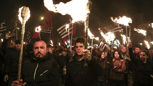 Supporters of Greece's extreme right Golden Dawn party raise torches during a rally commemorating a 1996 military incident which cost the lives of three Greek navy officers and brought Greece and Turkey to the brink of war, in Athens, on Saturday, Feb. 3, 2018 - Sputnik International