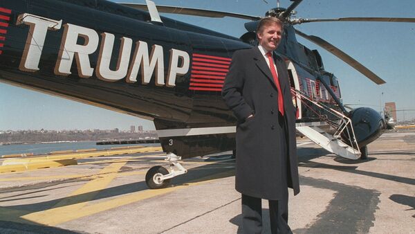 Donald Trump stands next to one of his three Sikorsky helicopters at New York Port Authority's West 30 Street Heliport in this March, 1988 photo - Sputnik International