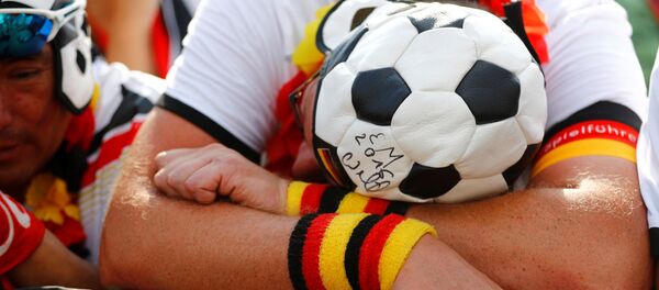Soccer Football - World Cup - Group F - Germany vs Mexico - Berlin - Germany - June 17, 2018 - Germany fans during the match at Brandenburg Gate - Sputnik International