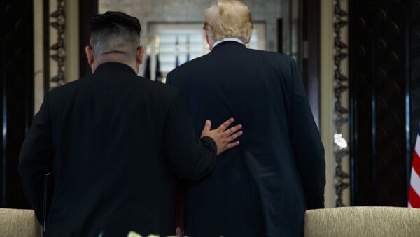 President Donald Trump and North Korean leader Kim Jong Un participate in a signing ceremony during a meeting on Sentosa Island, Tuesday, June 12, 2018, in Singapore - Sputnik International