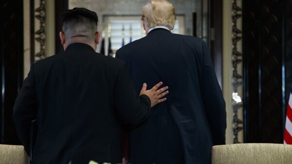 President Donald Trump and North Korean leader Kim Jong Un participate in a signing ceremony during a meeting on Sentosa Island, Tuesday, June 12, 2018, in Singapore - Sputnik International