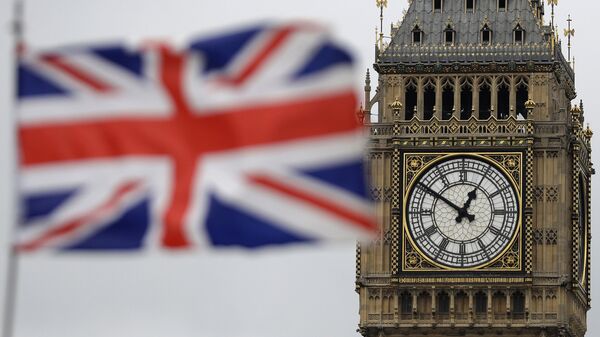 a British flag is blown by the wind near to Big Ben's clock tower in front of the UK Houses of Parliament in central London - Sputnik International