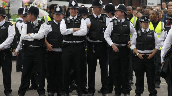 British police officers stand on duty during Europe's largest street festival, the Notting Hill Carnival in London, UK - Sputnik International