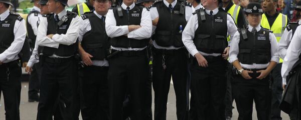 British police officers stand on duty during Europe's largest street festival, the Notting Hill Carnival in London, UK - Sputnik International