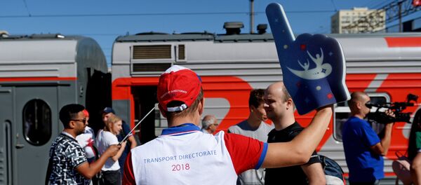 The volunteer meets fans before World Cup 2018 soccer match between the national teams of Tunisia and England at the railway station in Volgograd The volunteer meets fans before World Cup 2018 soccer match between the national teams of Tunisia and England at the railway station in Volgograd - Sputnik International