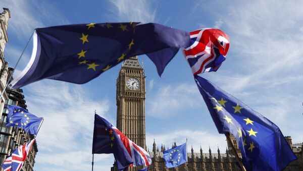 EU and Union flags fly above Parliament Square during a Unite for Europe march, in central London, Britain - Sputnik International
