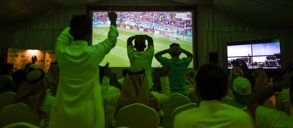 Saudi football fans cheer for their national team during their Russia 2018 World Cup Group A football match against Russia at a fan tent in the capital Riyadh on June 14, 2018 Saudi football fans cheer for their national team during their Russia 2018 World Cup Group A football match against Russia at a fan tent in the capital Riyadh on June 14, 2018 - Sputnik International