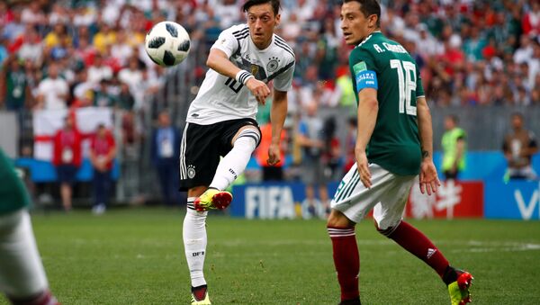 Soccer Football - World Cup - Group F - Germany vs Mexico - Luzhniki Stadium, Moscow, Russia - June 17, 2018 Germany's Mesut Ozil in action with Mexico's Andres Guardado - Sputnik International