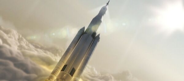 Artist's concept showing the 77-ton configuration of NASA’s Space Launch System rocket launching into space. - Sputnik International