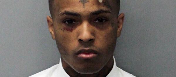 This 2017 arrest photo made available by the Miami Dade Dept. of Corrections shows Jahseh Onfroy, also known as the rapper XXXTentacion, under arrest. Onfroy was shot and killed, Monday, June 18, 2018, in Deerfield Beach, Fla. - Sputnik International