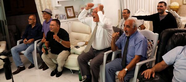 Israelis of Iranian origin cheer for Iran as they watch the Iran-Spain World Cup match in the living room of the Hasid family in Jerusalem, June 20, 2018 Israelis of Iranian origin cheer for Iran as they watch the Iran-Spain World Cup match in the living room of the Hasid family in Jerusalem, June 20, 2018 - Sputnik International