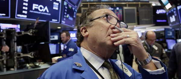 Trader Steven Kaplan works on the floor of the New York Stock Exchange, Tuesday, June 19, 2018. U.S. stock markets are opening sharply lower Tuesday as tensions over trade between the U.S. and China seem closer to a boil Trader Steven Kaplan works on the floor of the New York Stock Exchange, Tuesday, June 19, 2018. U.S. stock markets are opening sharply lower Tuesday as tensions over trade between the U.S. and China seem closer to a boil - Sputnik International