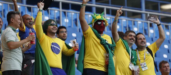 Brazilians fans gesture as they wait for the start of the group E match between Brazil and Switzerland at the 2018 soccer World Cup in the Rostov Arena in Rostov-on-Don, Russia, Sunday, June 17, 2018. (AP Photo/Darko Vojinovic) - Sputnik International