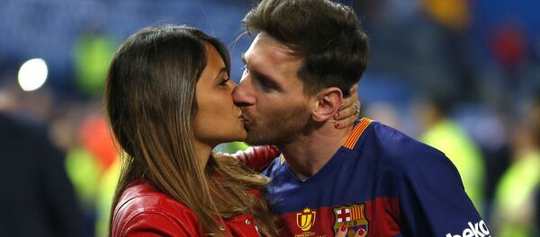 In this Sunday, May 22, 2016 file photo, Barcelona's Lionel Messi kisses his wife Antonella Roccuzzo as they celebrate after winning the final of the Copa del Rey soccer match between FC Barcelona and Sevilla FC at the Vicente Calderon stadium in Madrid - Sputnik International