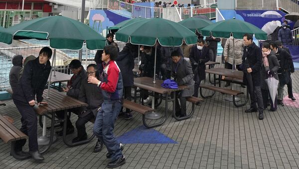 (File) Participants are guided during an evacuation drill simulating a North Korea ballistic missile attack in Tokyo, Monday, Jan. 22, 2018 - Sputnik International