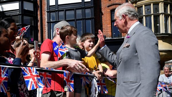 Britain's Prince Charles 'high-fives' a well-wisher during visit to Salisbury in southwest Britain, June 22, 2018 - Sputnik International