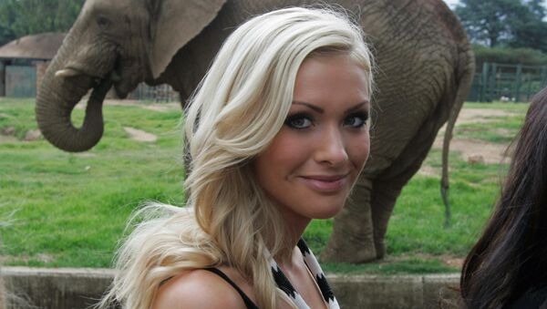 (File) Miss World participant Miss Iceland, Alexandra Helga Ivarsdottir stands in front of a elephant during a visit to the Zoo, inJohannesburg, South Africa, Saturday, Dec. 6, 2008 - Sputnik International