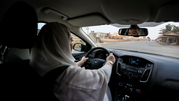 Dr Samira al-Ghamdi, 47, a practicing psychologist, drives around the side roads of a neighborhood as she prepares to hit the road on Sunday as a licensed driver, in Jeddah, Saudi Arabia June 21, 2018 - Sputnik International