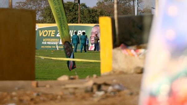 Police officers are seen at the White City Stadium, where Zimbabwe President Emmerson Mnangagwa escaped unhurt after an explosion rocked the stadium, in Bulawayo, Zimbabwe, June 23,2018 - Sputnik International