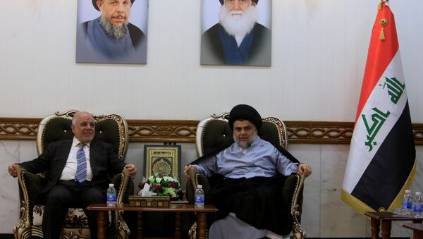Iraqi Prime Minister Haider al-Abadi, who's political bloc came third in a May parliamentary election, meets with cleric Moqtada al-Sadr, who's bloc came first, in Najaf - Sputnik International
