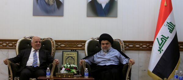 Iraqi Prime Minister Haider al-Abadi, who's political bloc came third in a May parliamentary election, meets with cleric Moqtada al-Sadr, who's bloc came first, in Najaf - Sputnik International