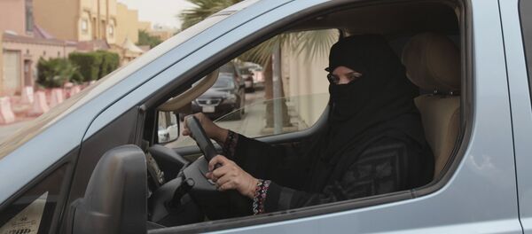 FILE- In this Saturday, March 29, 2014 file photo, a woman drives a car in Riyadh, Saudi Arabia, as part of a campaign to defy Saudi Arabia's ban on women driving. FILE- In this Saturday, March 29, 2014 file photo, a woman drives a car in Riyadh, Saudi Arabia, as part of a campaign to defy Saudi Arabia's ban on women driving. - Sputnik International