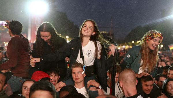 World Cup - Group F - Germany vs Sweden - Berlin, Germany - June 23, 2018 Germany soccer fans react after the match at a public viewing area at Brandenburg Gate. - Sputnik International