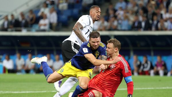 June 23, 2018 Sweden's Marcus Berg in action with Germany's Manuel Neuer and Jerome Boateng - Sputnik International