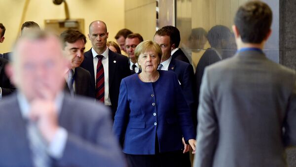 German Chancellor Angela Merkel arrives to take part in an emergency European Union leaders summit on immigration, in Brussels, Belgium June 24, 2018 - Sputnik International