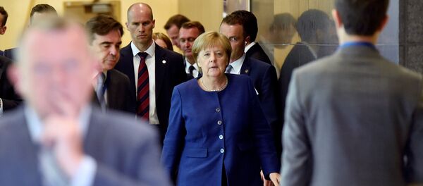 German Chancellor Angela Merkel arrives to take part in an emergency European Union leaders summit on immigration, in Brussels, Belgium June 24, 2018 - Sputnik International