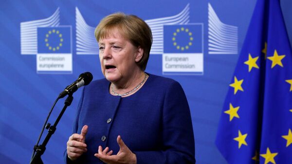 Germany's Chancellor Angela Merkel addresses media representatives as she arrives ahead of a summit at EU headquarters in Brussels on June 24, 2018 - Sputnik International