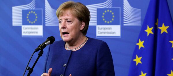 Germany's Chancellor Angela Merkel addresses media representatives as she arrives ahead of a summit at EU headquarters in Brussels on June 24, 2018 - Sputnik International