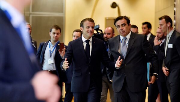 French President Emmanuel Macron arrives to take part in an emergency European Union leaders summit on immigration, in Brussels, Belgium June 24, 2018 - Sputnik International