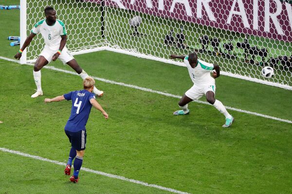 Soccer Football - World Cup - Group H - Japan vs Senegal - Ekaterinburg Arena, Yekaterinburg, Russia - June 24, 2018 Japan's Keisuke Honda scores their second goal  - Sputnik International