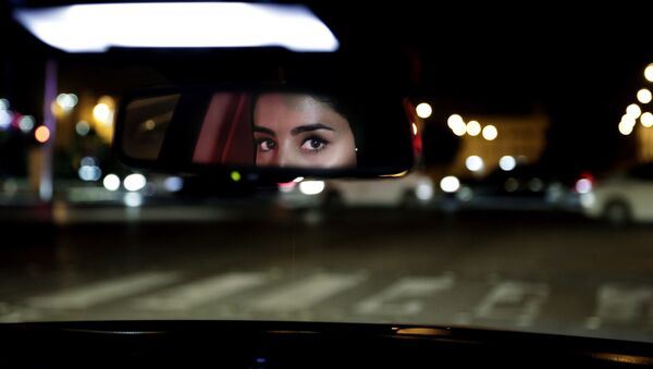 Hessah al-Ajaji drivers her car down the capital's busy Tahlia Street after midnight for the first time in Riyadh, Saudi Arabia, Sunday, June 24, 2018. - Sputnik International