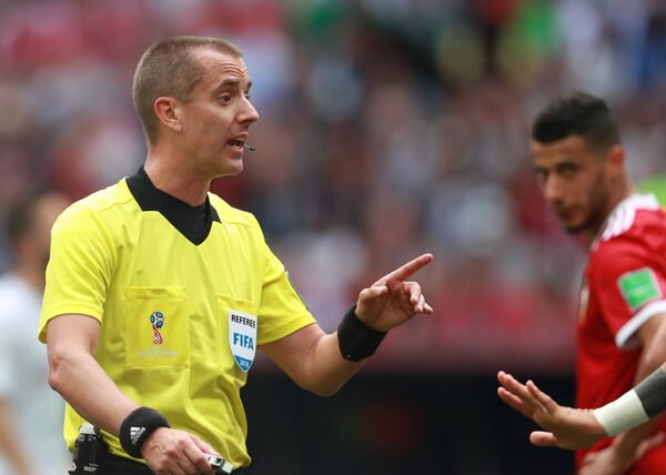The referee Mark Geiger talks to an unseen player during the World Cup Group B soccer match between Portugal and Morocco at the Luzhniki stadium, in Moscow, Russia, June 20, 2018. The referee Mark Geiger talks to an unseen player during the World Cup Group B soccer match between Portugal and Morocco at the Luzhniki stadium, in Moscow, Russia, June 20, 2018. - Sputnik International