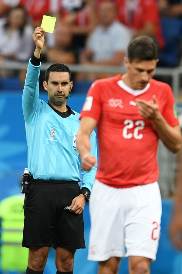 Referee Cesar Ramos shows the yellow card to Switzerland's Fabian Schaer during the World Cup Group E soccer match between Brazil and Switzerland in Rostov-on-Don, Russia, June 17, 2018. Referee Cesar Ramos shows the yellow card to Switzerland's Fabian Schaer during the World Cup Group E soccer match between Brazil and Switzerland in Rostov-on-Don, Russia, June 17, 2018. - Sputnik International