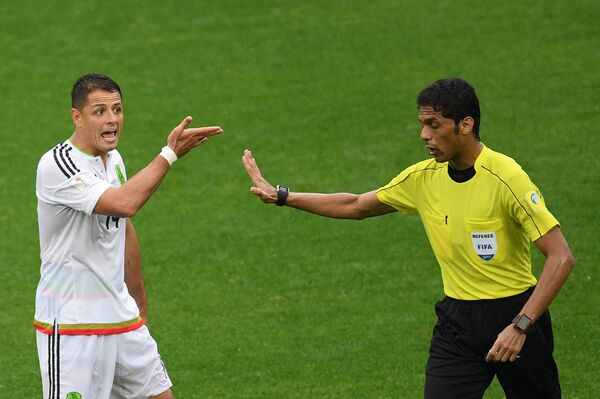 From left: Mexico’s Javier Hernandez and Referee Fahad Al-Mirdasi during the 2017 FIFA Confederations Cup third-place match between Portugal and Mexico. From left: Mexico’s Javier Hernandez and Referee Fahad Al-Mirdasi during the 2017 FIFA Confederations Cup third-place match between Portugal and Mexico. - Sputnik International